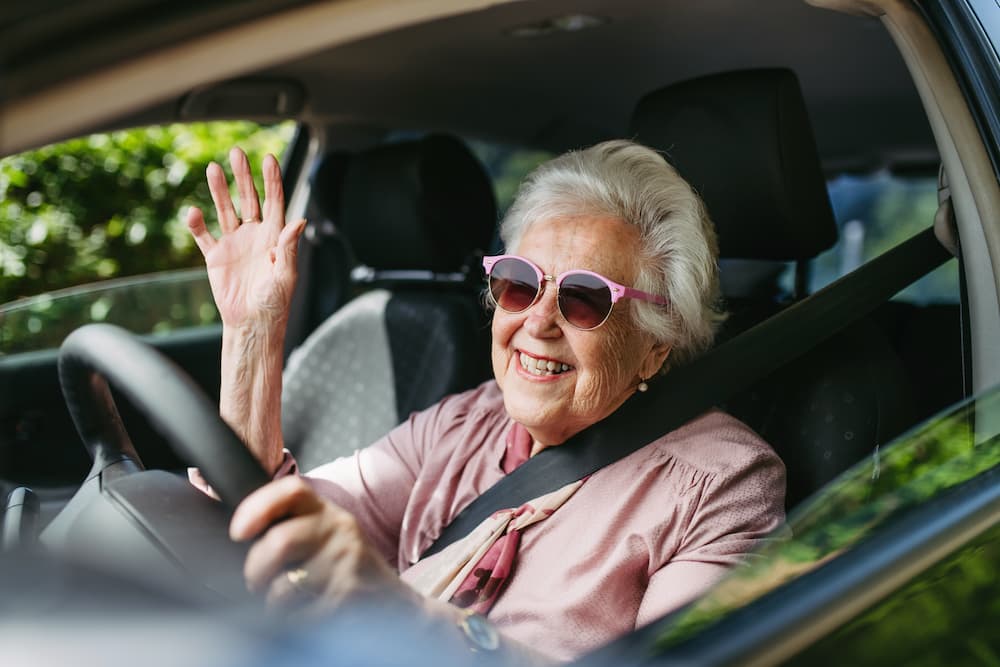 senior woman driving a car