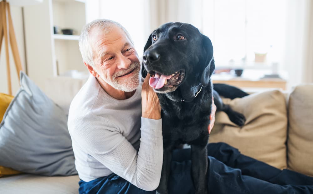 senior resident with his pet dog